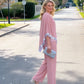 Set aus elegantem Poncho-Oberteil mit Paillettenbesatz und weit geschnittener Hose