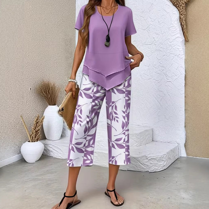 👗🔥 Damen Zweiteiler Set mit asymmetrischem Saum – Einfarbig Kurzarm-Oberteil + bedruckte Weitbeinhose in Größen S-5XL, 4 Farben