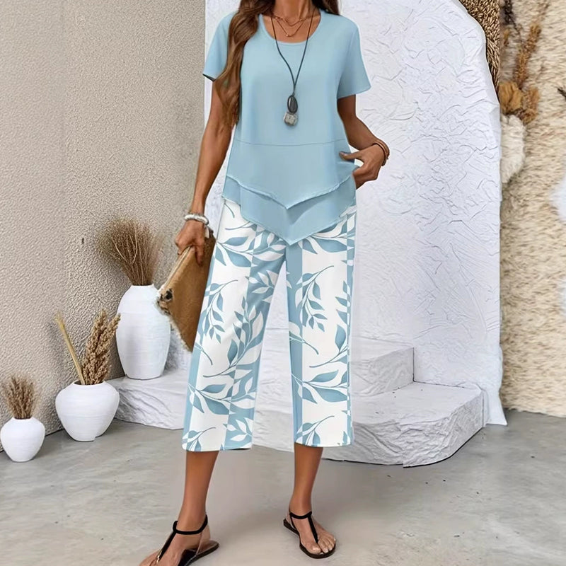 👗🔥 Damen Zweiteiler Set mit asymmetrischem Saum – Einfarbig Kurzarm-Oberteil + bedruckte Weitbeinhose in Größen S-5XL, 4 Farben